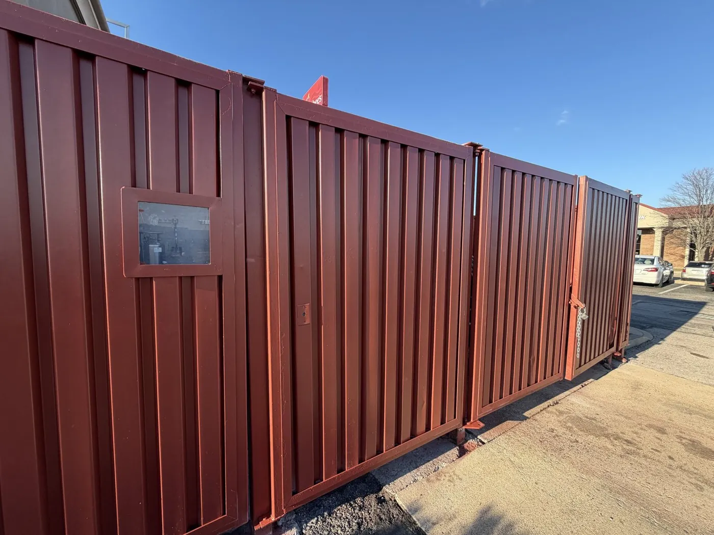Rusted trash enclosure, repainted