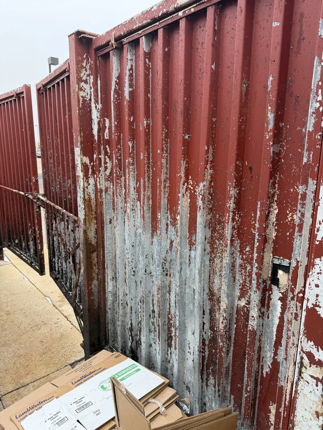Before: trash enclosure
