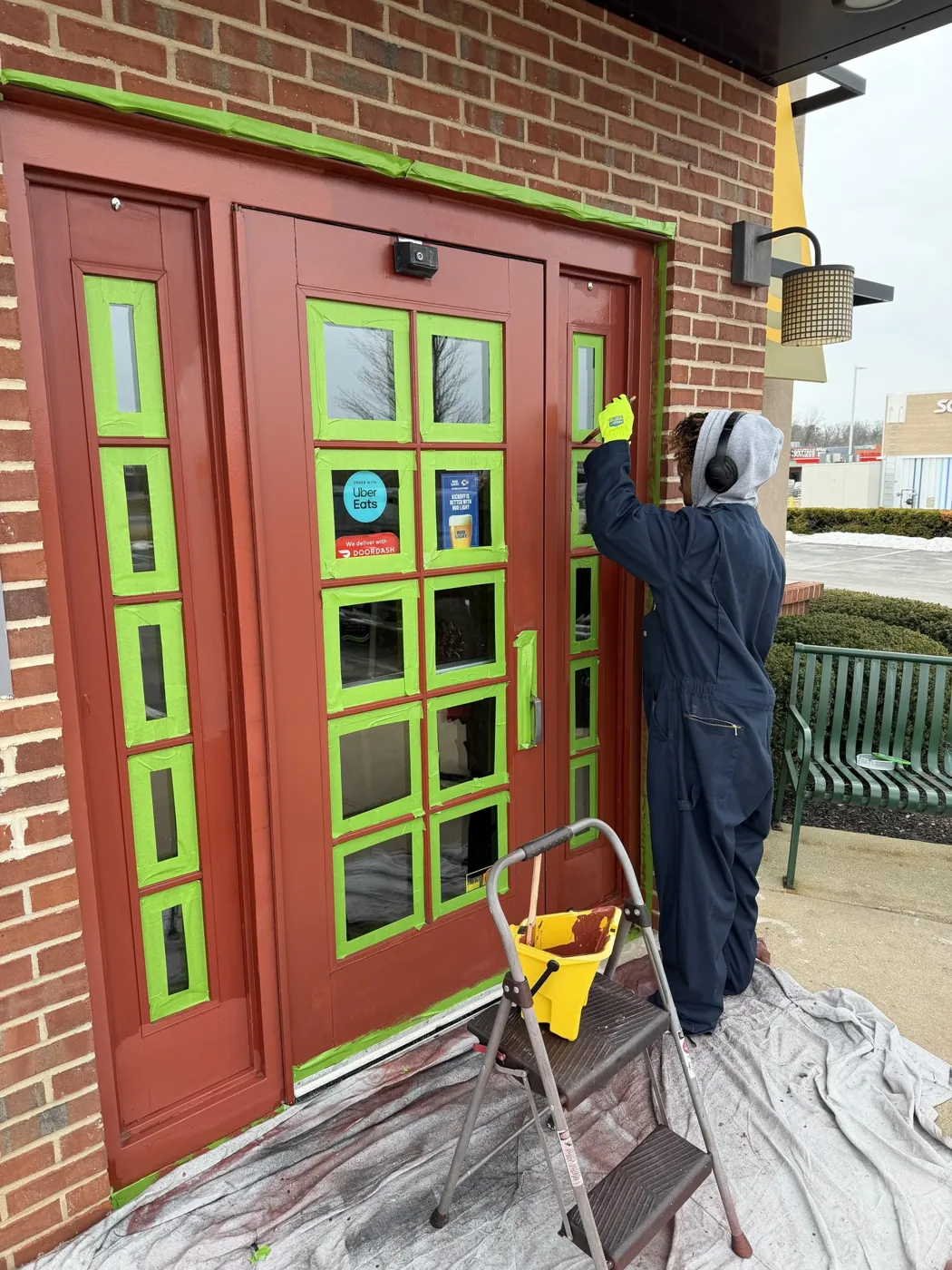 Storefront doors masked and painted