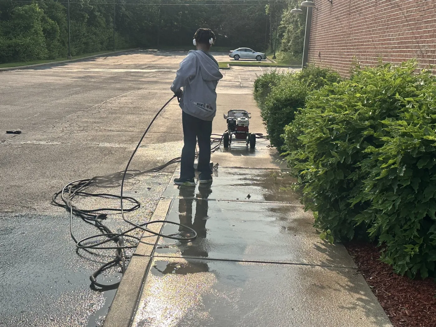 Pressure washing a commercial walkway